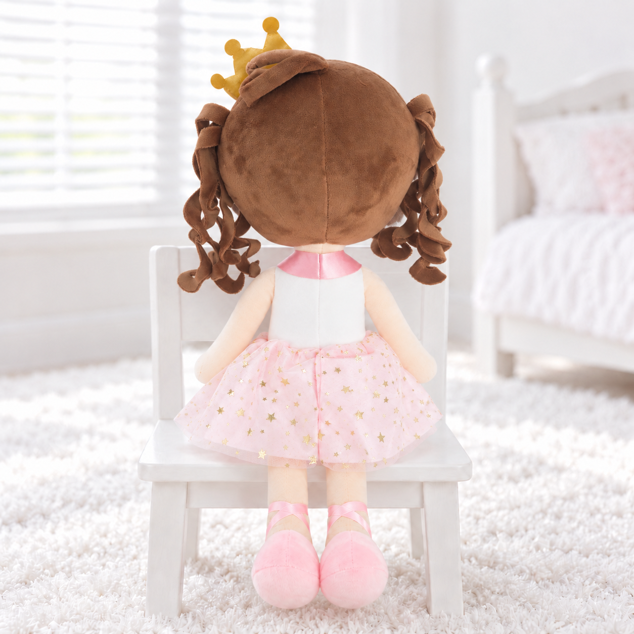 Chestnut haired doll on white chair