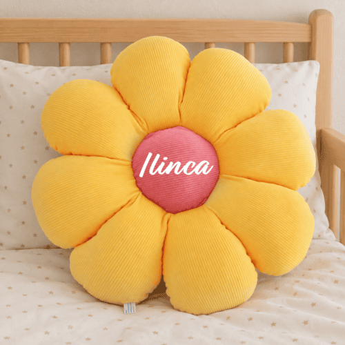Eight petal flower cushion on a child's bed 1