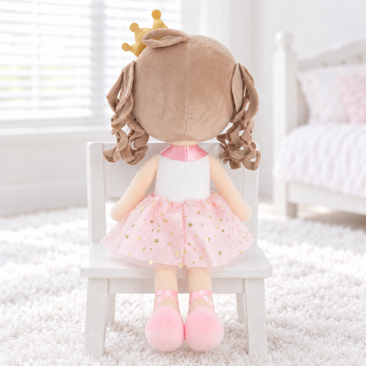 Plush doll's rear view on white chair